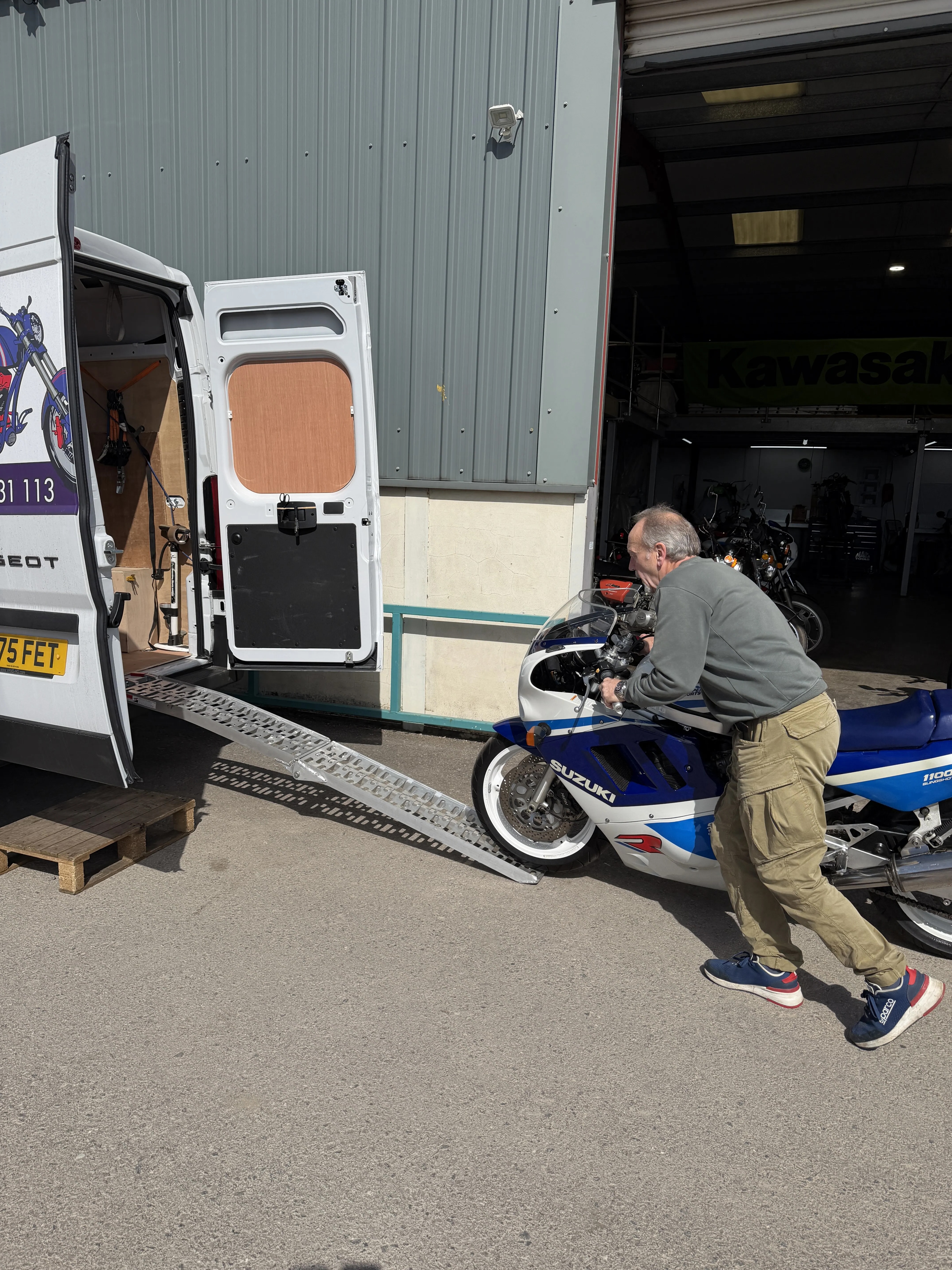 Andrew with his blue and white Suzuki GSX-R